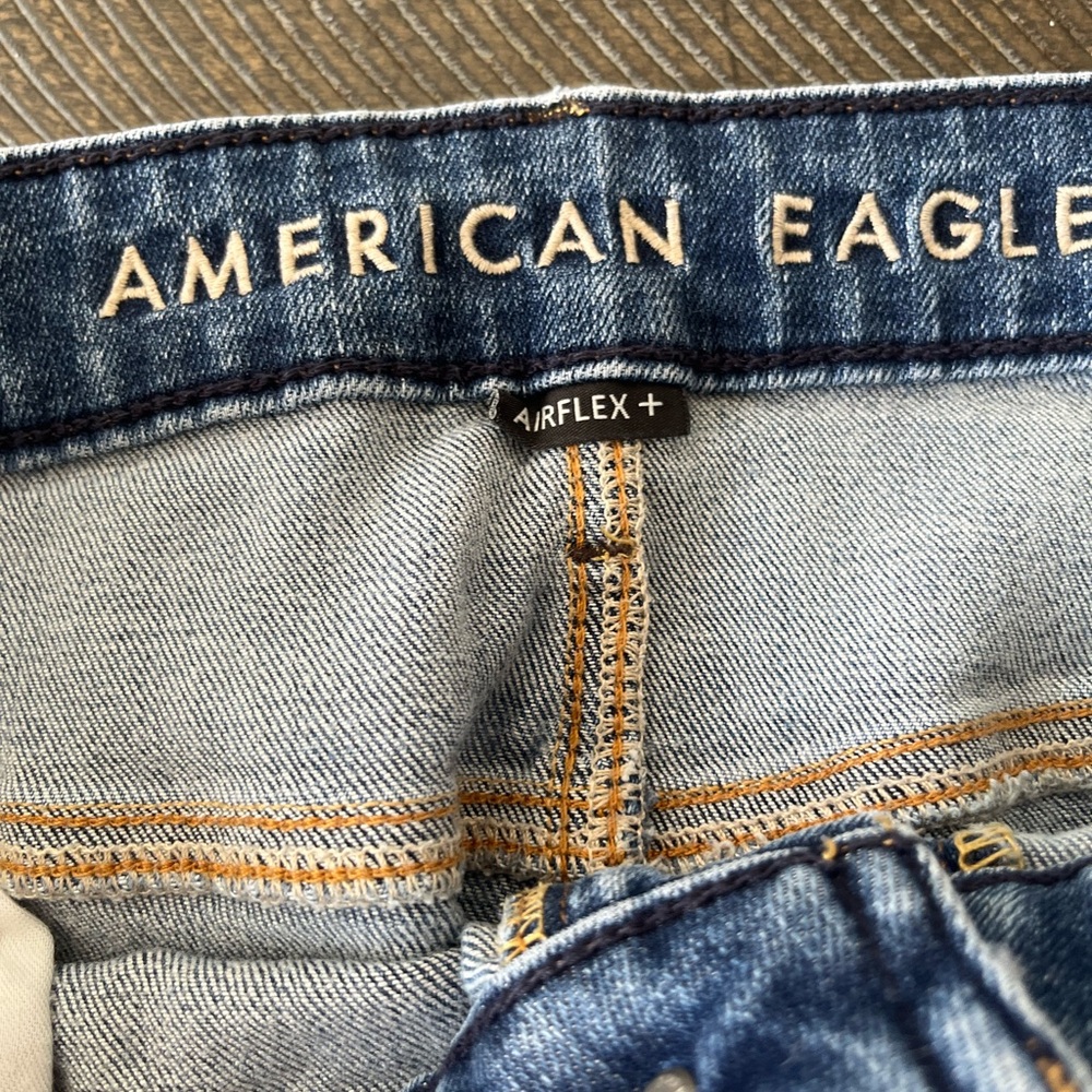 American Eagle Outfitters Distressed Medium Blue Denim Jeans with Tan Patch